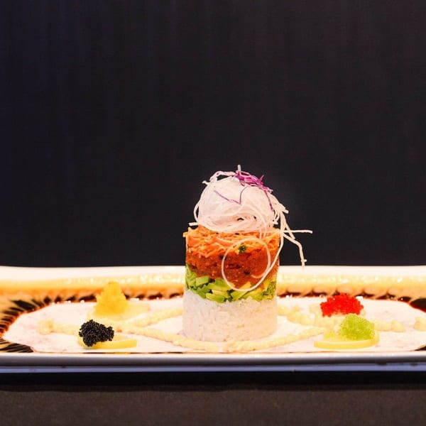 Kirin Asian Cuisine & Sushi's tuna tartare tower with avocado, rice, and colorful roe.